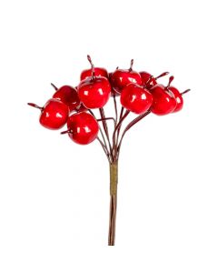 Rama artificial navideña con fruto rojo